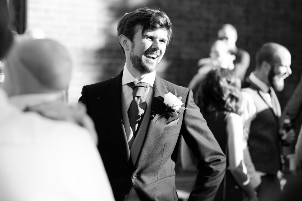 A groom smiling just after his wedding in Wolverhampton