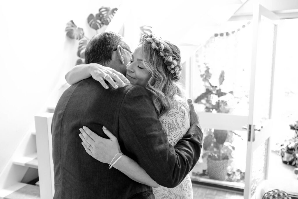 Bride photographed hugging her dad